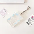 Transparent acrylic photocard holder with light blue ribbon print and heart metal buckle - Blue