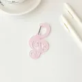 Llavero de acrílico rosa translúcido en forma de clave de sol con lunares y corazones - Rosa