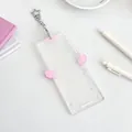 Acrylic card holder with pink angel wings and a silver star-shaped metal clasp - Pink