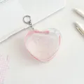 Pink heart-shaped PVC mini storage bag with silver keychain for small accessories - Pink