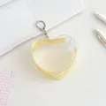 Transparent heart-shaped PVC mini pouch with a yellow zipper and metal keychain ring - Yellow
