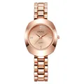 Detail of rose gold quartz watch featuring diamond accents and geometric cut-glass case - Rose Gold