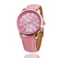 Women's pink fashion watch with rose gold case and Roman numeral dial on white background - Pink