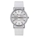Close-up of a silver quartz watch with a mesh steel strap and sunray textured dial - Silver