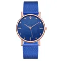 Reloj elegante en oro rosa con esfera de cielo estrellado azul y correa de malla - Azul