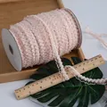 Pizzo corona elastico rosa chiaro con motivo a onde su rocchetto per artigianato - Albicocca
