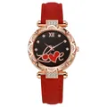 Close-up of starry black dial with Love text and rose gold rhinestone set case - Red