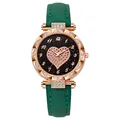 Detail of rose gold watch case with crystal bezel and heart shaped sparkling starry dial - Green