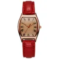 Detail of rose gold tonneau watch with red crocodile leather strap and Roman numerals - Red