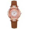 Detailed close-up of rose gold watch dial with rhinestones and brown suede leather strap - Coffee