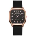 Macro view of square rose gold watch case with black textured dial and numeric indices - Black