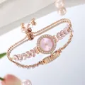 Detail of adjustable rose gold bracelet watch with pink stones and crystal bezel - Pink