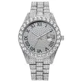 Macro view of full silver iced-out watch showing Roman numerals and date window - Silver
