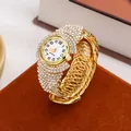 Elegant gold-tone women's quartz watch with sparkling rhinestones and multi-row bracelet - Gold