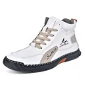 Bottes hautes en cuir blanc avec empiècements en daim gris et semelles en caoutchouc - Blanc