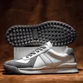 Retro German trainer sneakers with white leather suede panels and studded rubber soles - 38 / Gray