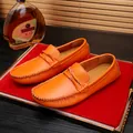 Men's orange pebble grain leather loafers featuring handcrafted stitching and knot detail - 38 / Casual Loafers (9959) / Orange