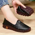 Flexible black leather flat loafers for women with breathable cutout patterns and soft sole - EU 38 / Black