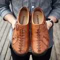 Men's brown leather loafers featuring handmade stitching and slip-on style design - EU 38 / Red Brown