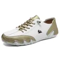 Low-top white and champagne gold casual sneakers with animal logo and AUS tag details - Platinum