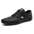 Chaussures décontractées en cuir noir pour hommes avec logo chèvre et semelle ondulée - Noir