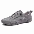 Grey breathable outdoor sports sneaker with mesh panels and durable non-slip sole - EU 38 / Gray