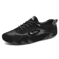 Men's casual black sneakers with breathable mesh panels and wavy sole design - 35 / Black