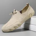 Beige men's slip-on leather loafers with drawstring detail and wave-textured rubber sole - EU 38 / Khaki
