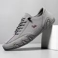 Grey suede men's casual low-top shoes with red logo and wavy non-slip rubber soles - Gray