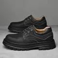 Men's low-top black leather Martin boots with pebble grain texture and thick rubber soles - Black