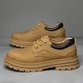 Men's low-top leather work boots in brown with yellow stitching and thick rubber soles - Yellow