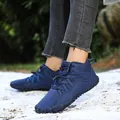 Outdoor high-top snow boots with waterproof fabric and plush lining on a model - EU 38 / Dark Blue