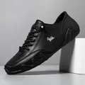 Men's black leather casual shoes with lace-up design and silver abstract logo accent - Black