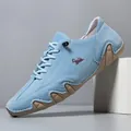 Light blue suede casual men's shoe with purple logo and wavy gum sole detail - Blue