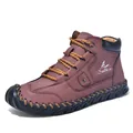 Detailed close-up of brown leather ankle boots with hand-stitched seams and laces - EU 38 / Burgundy