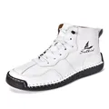 Detail view of white leather high-top boots featuring Salkin logo and handmade stitching - EU 38 / White