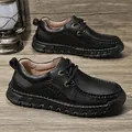 Classic black men's casual leather loafers with hand-stitched detailing and thick sole - EU 38 / Black