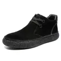 Detailed macro view of black suede desert boots with white contrast stitching and durable thick sole - EU 40 / Black