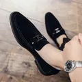Men's black suede loafers with silver V-buckle accent on vintage wood floor - EU 38 / Black