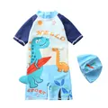 Close-up of boys dinosaur one-piece swimsuit with matching hat and 3D tail detail - S / Light Blue Surfing Dinosaur Design