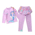 Flat lay of girls' long sleeve mermaid swimsuit set with lavender top and printed pants - Chasing Meteors