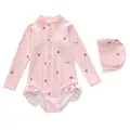 Detail of pink long sleeve girls swimsuit with cherry print and ruffled leg openings - Pink Cherry