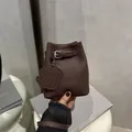 Minimalist dark brown litchi pattern mini bucket bag with a cute dog pendant and silver buckle - Coffee