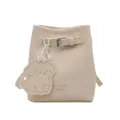 Cream pebbled leather mini bucket bag with adjustable strap and cute dog bag charm - White