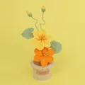 Handmade crochet potted Tung blossoms with yellow and orange flowers in a knit pot - Gradient Yellow