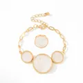 Golden jewelry set with white marble style round charms featuring a bracelet and ring - Bracelet+Ring