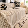 Creamy striped sofa throw cover with elegant tassel edges and matching pillows - Off White