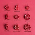 Red cinnabar stone jewelry charms in nine various Chinese auspicious floral and animal shapes - Lotus Style (Style 9)
