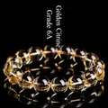 Grade 6A yellow citrine crystal beaded bracelet with natural ice cracks on black background - Grade 6A Electric Yellow Citrine / 9-9.8mm