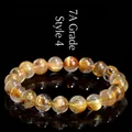 7A grade natural golden rutilated quartz beaded bracelet on a black mirror finish - 8-8.8mm (Approx. 23 Beads) / 7A Grade Gold Rutilated Style 4